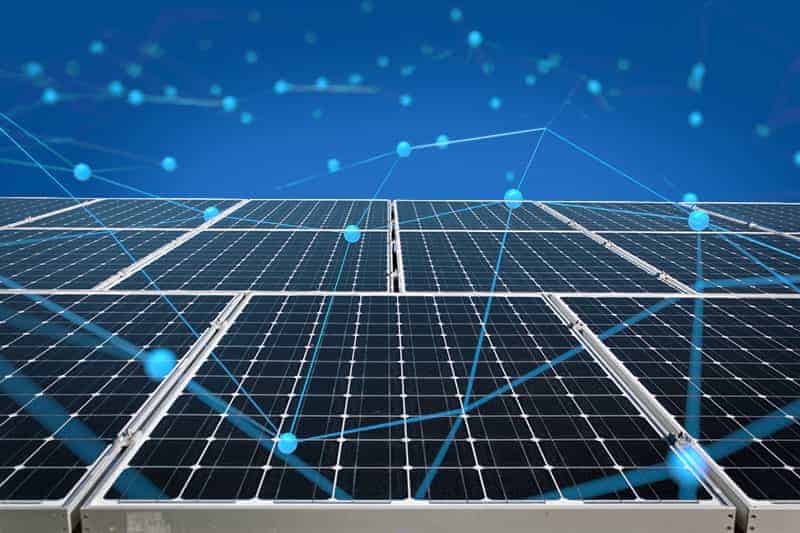 solar-panels-with-blockchain-graphic-in-a-blue-background