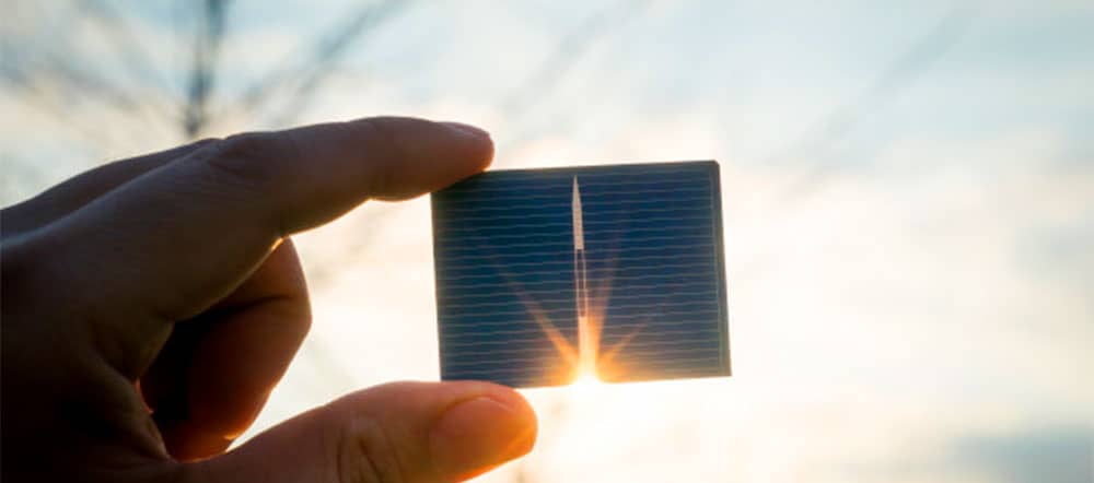 hand holding solar cell